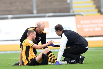 070924 - Newport County v Port Vale - Sky Bet League 2 - Shane McLoughlin of Newport County goes off the field injured