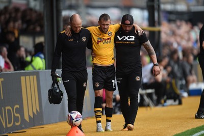 070924 - Newport County v Port Vale - Sky Bet League 2 - Shane McLoughlin of Newport County goes off the field injured