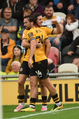 070924 - Newport County v Port Vale - Sky Bet League 2 - Aaron Wildig of Newport County celebrates scoring a goal to equalise the game with team mates