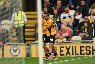 070924 - Newport County v Port Vale - Sky Bet League 2 - Aaron Wildig of Newport County celebrates scoring a goal to equalise the game with team mates