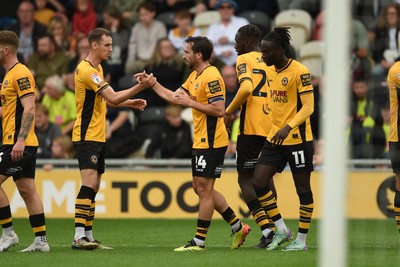 070924 - Newport County v Port Vale - Sky Bet League 2 - Aaron Wildig of Newport County celebrates scoring a goal to equalise the game with team mates