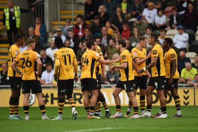 070924 - Newport County v Port Vale - Sky Bet League 2 - Aaron Wildig of Newport County celebrates scoring a goal to equalise the game with team mates