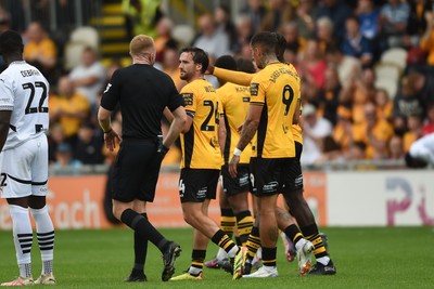 070924 - Newport County v Port Vale - Sky Bet League 2 - Aaron Wildig of Newport County celebrates scoring a goal to equalise the game with team mates