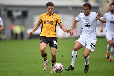 070924 - Newport County v Port Vale - Sky Bet League 2 - Oliver Greaves of Newport County is challenged by Tom Sang of Port Vale