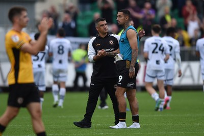 070924 - Newport County v Port Vale - Sky Bet League 2 - Newport Head Coach, Nelson Jardim and Courtney Baker-Richardson of Newport County looking dejected at full time