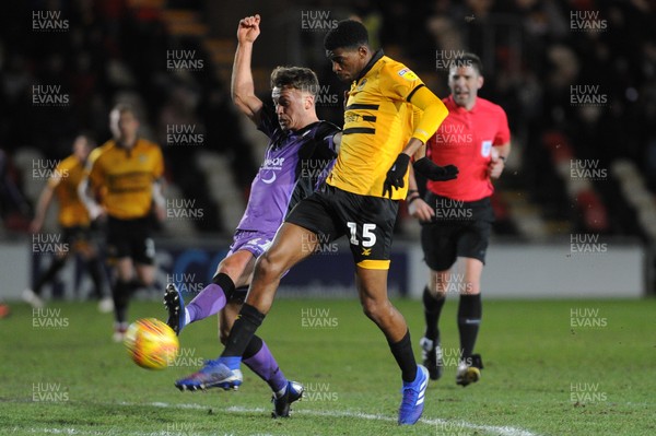 290119 - Newport County v Port Vale - Sky Bet League 2 -  Tyreeq Bakinson of Newport County shoots under pressure from Luke Hannant of Port Vale