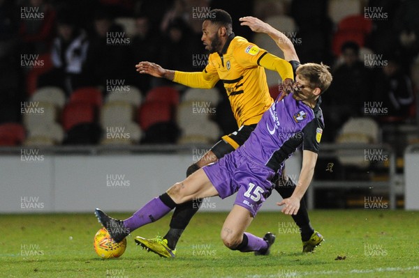290119 - Newport County v Port Vale - Sky Bet League 2 -   Jamille Matt of Newport County is tackled by Nathan Smith of Port Vale