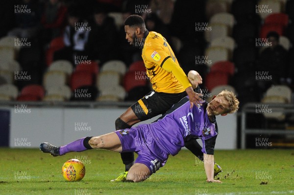 290119 - Newport County v Port Vale - Sky Bet League 2 -   Jamille Matt of Newport County is tackled by Nathan Smith of Port Vale