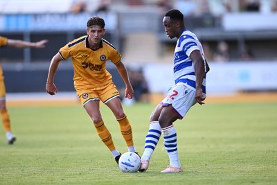 280726 - Newport County v Reading - Preseason Friendly - Harrison Biggins of Newport County is challenged by Udoke Godwin-Malife of Reading