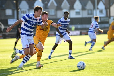 280726 - Newport County v Reading - Preseason Friendly - Lee Jenkins of Newport County is challenged by Ben Ward of Reading