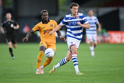 280726 - Newport County v Reading - Preseason Friendly - Shaquille Gwengwe of Newport County is challenged by Ben Ward of Reading