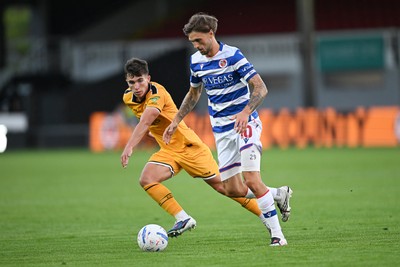 280726 - Newport County v Reading - Preseason Friendly - Harrison Pugh of Newport County is challenged by Lewis Wing of Reading