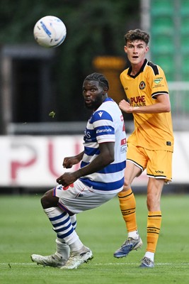 280726 - Newport County v Reading - Preseason Friendly - Joe Thomas of Newport County is challenged by Emmanuel Osho of Reading