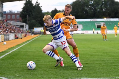 280726 - Newport County v Reading - Preseason Friendly - Cameron Norman of Newport County is challenged by Paddy Lane of Reading