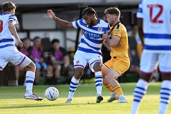 280726 - Newport County v Reading - Preseason Friendly - Andy Rinomhota of Reading is challenged by Cameron Evans of Newport County