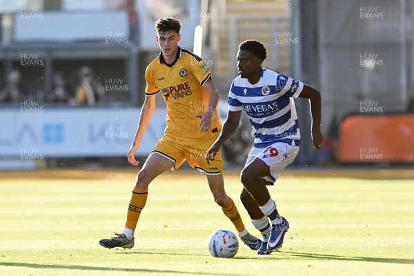 280726 - Newport County v Reading - Preseason Friendly - Joe Thomas of Newport County is challenged by Kyreece Lisbie of Reading