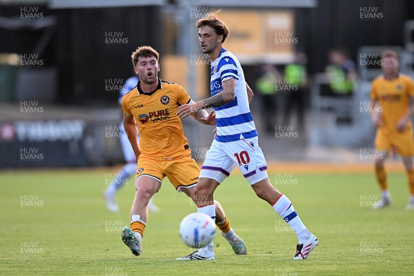 280726 - Newport County v Reading - Preseason Friendly - Cameron Evans of Newport County is challenged by Lewis Wing of Reading