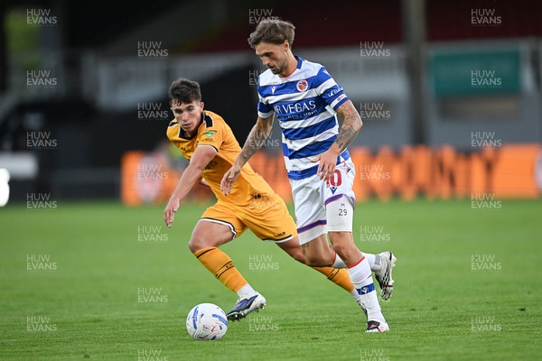280726 - Newport County v Reading - Preseason Friendly - Harrison Pugh of Newport County is challenged by Lewis Wing of Reading