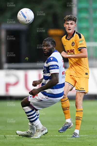 280726 - Newport County v Reading - Preseason Friendly - Joe Thomas of Newport County is challenged by Emmanuel Osho of Reading