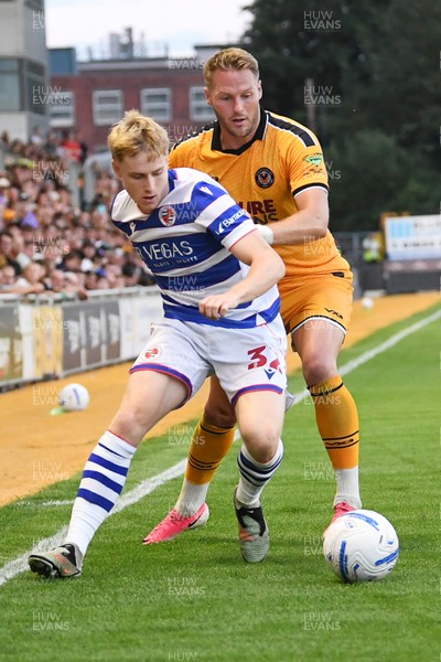 280726 - Newport County v Reading - Preseason Friendly - Cameron Norman of Newport County is challenged by Paddy Lane of Reading