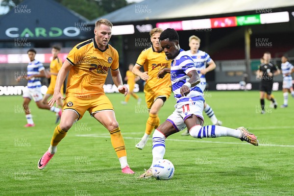 280726 - Newport County v Reading - Preseason Friendly - Cameron Norman of Newport County is challenged by Daniel Kyerewaa of Reading