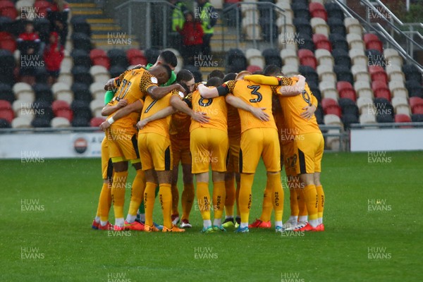 021119 - Newport County v Salford City - Sky Bet League 2 - Players of Newport County huddle before kick off 
