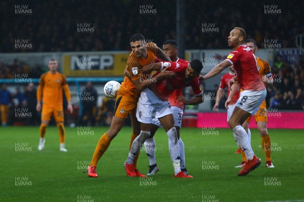 021119 - Newport County v Salford City - Sky Bet League 2 - Ryan Inniss of Newport County and Jake Jervis of Salford City compete for the ball 