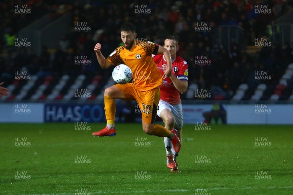 021119 - Newport County v Salford City - Sky Bet League 2 - Josh Sheehan of Newport County  beats Adam Rooney of Salford City to a loose ball