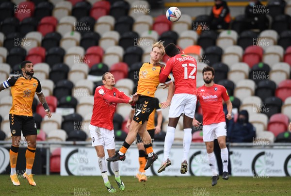 160121 - Newport County v Salford City - SkyBet League 2 - Jake Scrimshaw of Newport County and Di'Shon Bernard of Salford City compete in the air