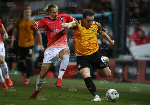 190220 - Newport County v Salford City - Leasingcom Trophy - Matthew Dolan of Newport County is tackled by Oscar Threlkeld of Salford City