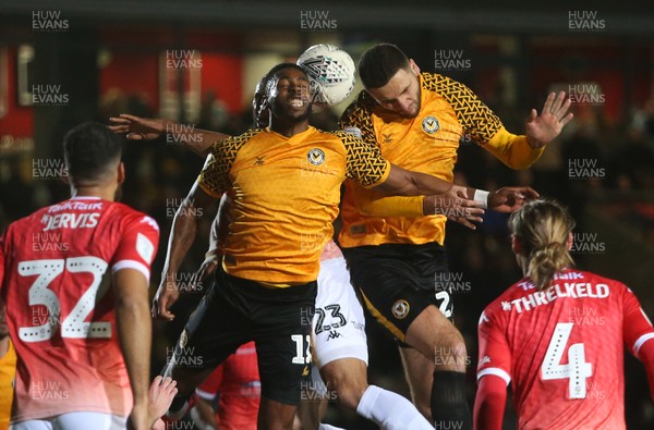 190220 - Newport County v Salford City - Leasingcom Trophy - Jamille Matt and Ryan Innis of Newport County go up for the ball