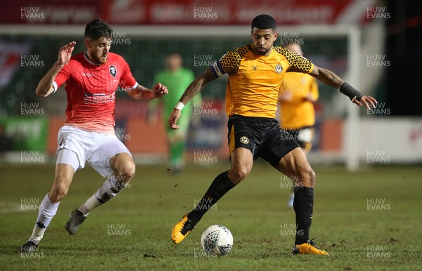 190220 - Newport County v Salford City - Leasingcom Trophy - Joss Labadie of Newport County is challenged by Jack Baldwin of Salford City