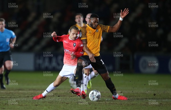 190220 - Newport County v Salford City - Leasingcom Trophy - Jamille Matt of Newport County is tackled by Oscar Threlkeld of Salford City