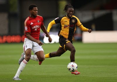 190825 - Newport County v Salford City - SkyBet League Two - Michael Reindorf of Newport County is challenged by Adebola Oluwo of Salford City 