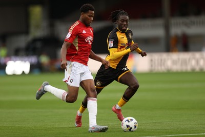 190825 - Newport County v Salford City - SkyBet League Two - Michael Reindorf of Newport County is challenged by Adebola Oluwo of Salford City 