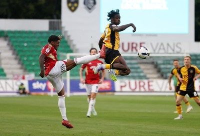 190825 - Newport County v Salford City - SkyBet League Two - Habeeb Ogunneye of Newport County is challenged by Kadeem Harris of Salford City 