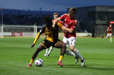 190825 - Newport County v Salford City - SkyBet League Two - Michael Reindorf of Newport County is challenged by Ben Woodburn of Salford City 