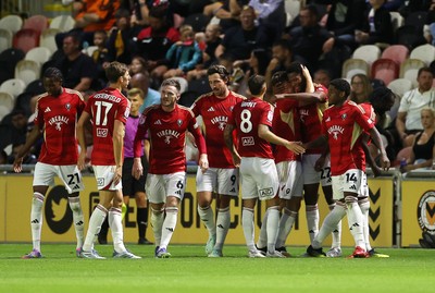 190825 - Newport County v Salford City - SkyBet League Two - Adebola Oluwo of Salford City celebrates scoring a goal with team mates