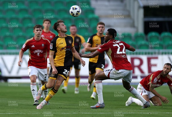 190825 - Newport County v Salford City - SkyBet League Two - Ben Lloyd of Newport County is challenged by Adebola Oluwo of Salford City 
