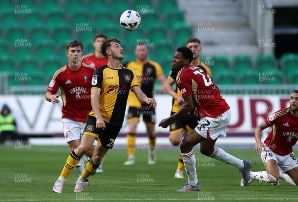 190825 - Newport County v Salford City - SkyBet League Two - Ben Lloyd of Newport County is challenged by Adebola Oluwo of Salford City 