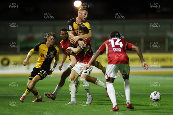 190825 - Newport County v Salford City - SkyBet League Two - Lee Jenkins of Newport County collides with Luke Garbutt of Salford City 