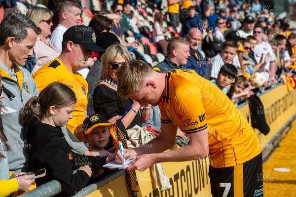 200424 - Newport County v Salford City - Sky Bet League 2  -  Will Evans of Newport County signs autographs for the fans 