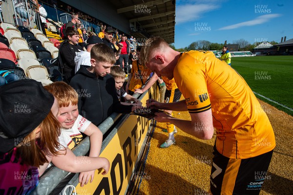 200424 - Newport County v Salford City - Sky Bet League 2  -  Will Evans of Newport County signs autographs for the fans 
