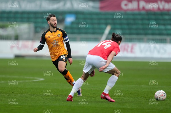 281120 - Newport County v Salford City - FA Cup Second Round - Josh Sheehan of Newport County lays a ball off past George Boyd of Salford City   