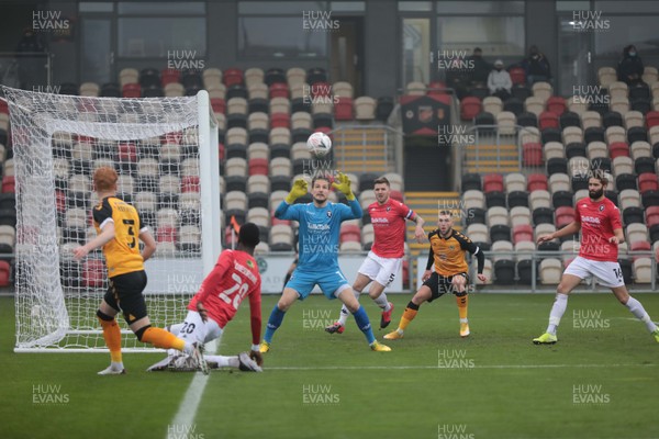 281120 - Newport County v Salford City - FA Cup Second Round - Ryan Haynes of Newport County crosses into the box under pressure from Mani Dieseruvwe of Salford City 
