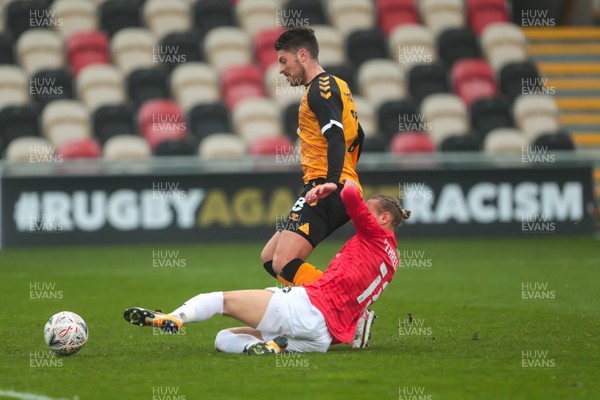 281120 - Newport County v Salford City - FA Cup Second Round - Jamie Proctor of Newport County is tackled on his way to goal by Oscar Threlkeld of Salford City   