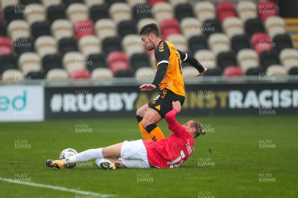281120 - Newport County v Salford City - FA Cup Second Round - Jamie Proctor of Newport County is tackled on his way to goal by Oscar Threlkeld of Salford City  
