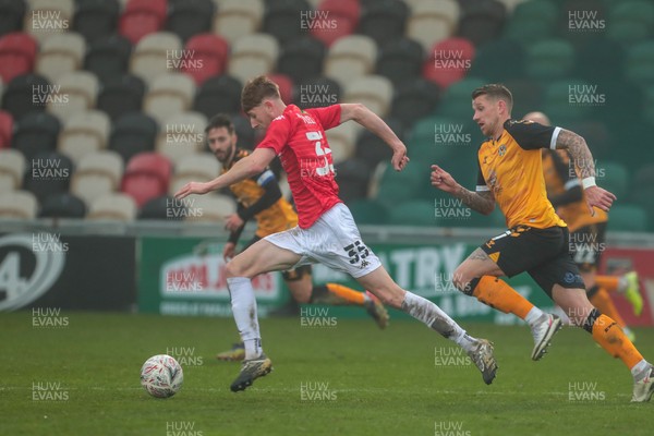 281120 - Newport County v Salford City - FA Cup Second Round - Sam Fielding of Salford City chased by Scot Bennett of Newport County   