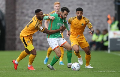 191019 - Newport County v Scunthorpe United - SkyBet League Two - Alex Gilliead of Scunthorpe United is tackled by Jamille Matt of Newport County