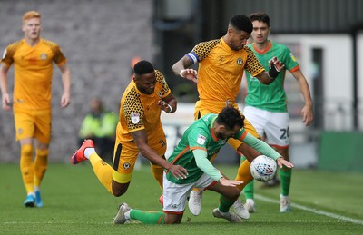 191019 - Newport County v Scunthorpe United - SkyBet League Two - Alex Gilliead of Scunthorpe United is tackled by Jamille Matt of Newport County